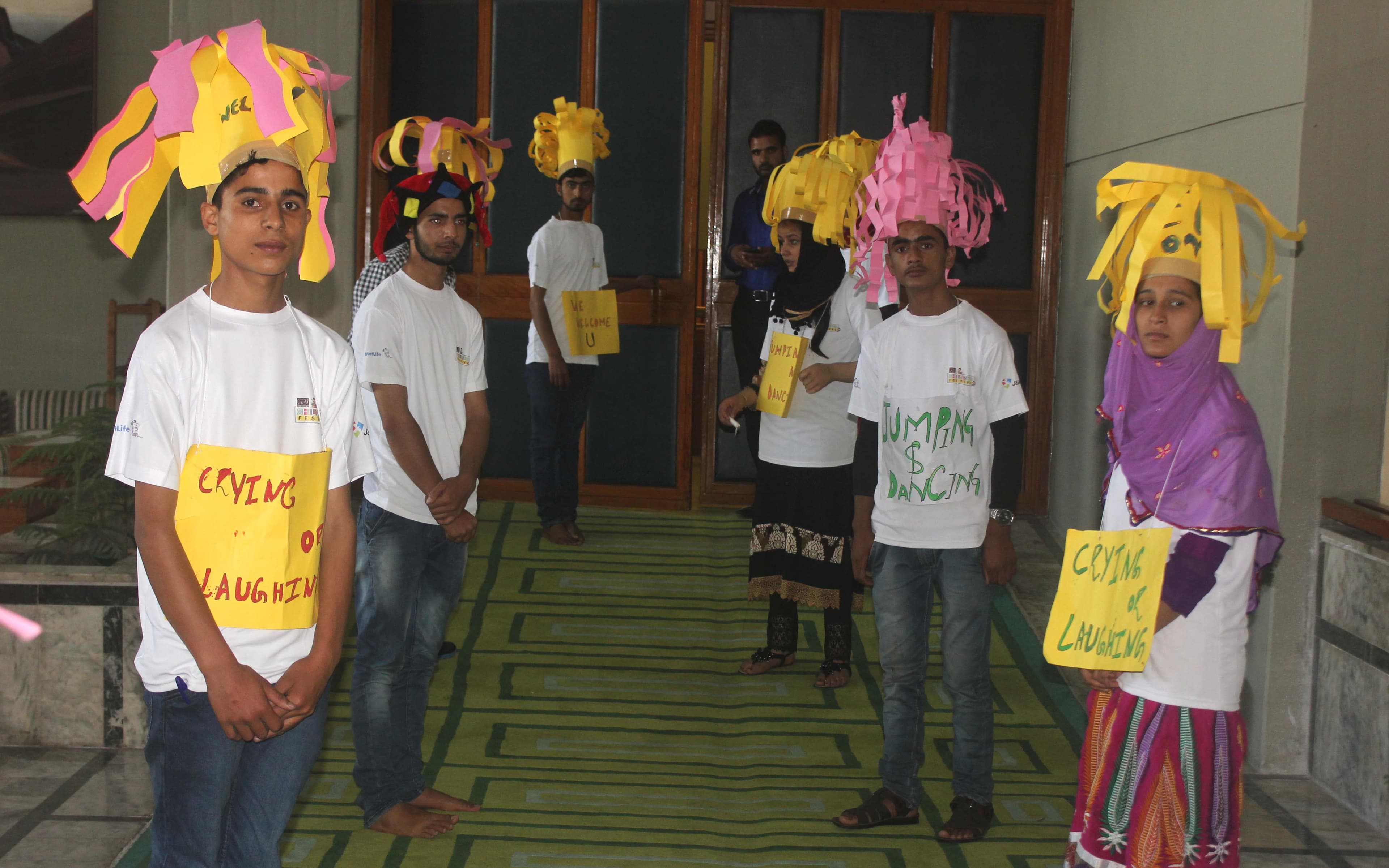 Community members and forest department officials taking a public pledge at an awareness event