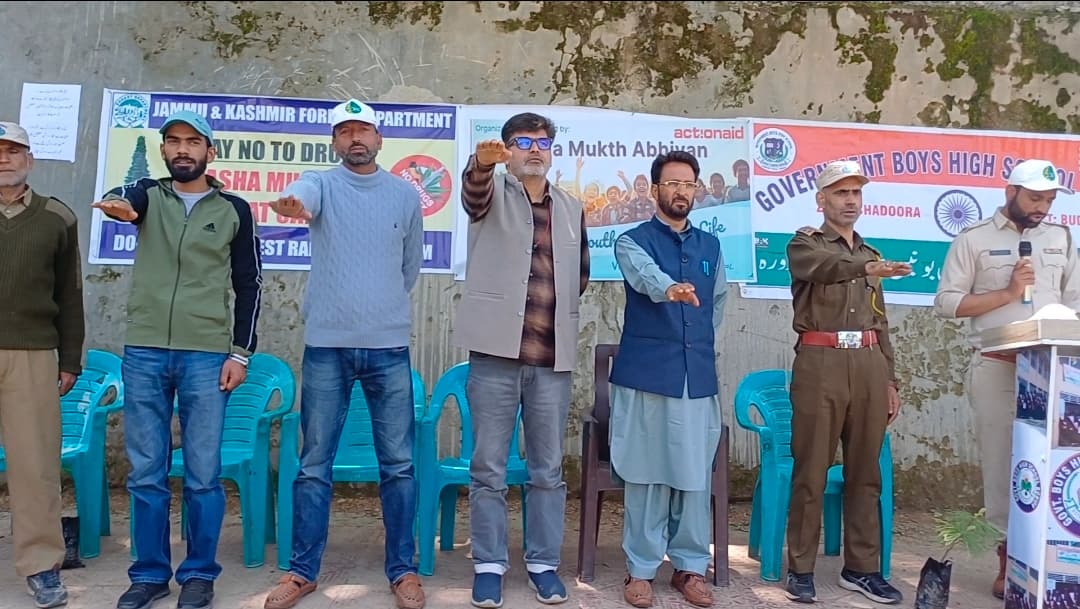 Community members and forest department officials taking a public pledge at an awareness event